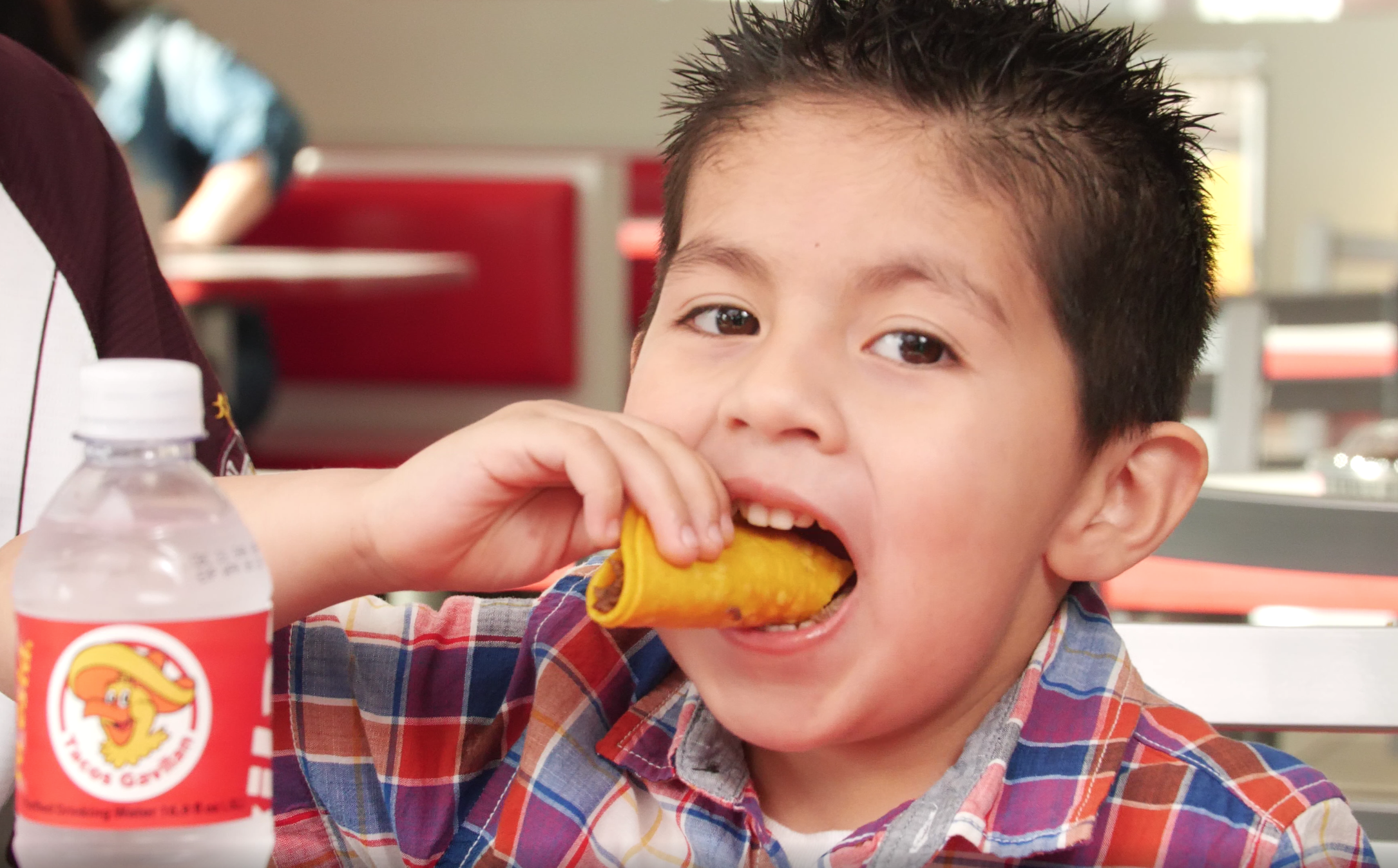 Boy eating tacos in los angeles